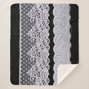 Ornamental white lace, isolated black background. sherpa blanket