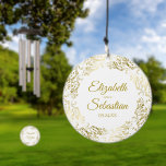 Ornate Gold Border White Wedding Couples Names Wind Chime<br><div class="desc">These beautiful wind chimes are perfect as a wedding or anniversary gift, or they can be used as decorations and serve as a beautiful memento of your special day. The design features an ornate golden border with curls and swirls with the names of the couple and wedding date in the...</div>