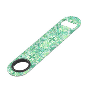 Ornate tiles in green and white bar key