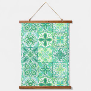 Ornate tiles in green and white hanging tapestry