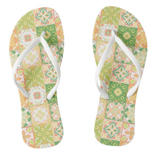 Ornate tiles in green and yellow flip flops