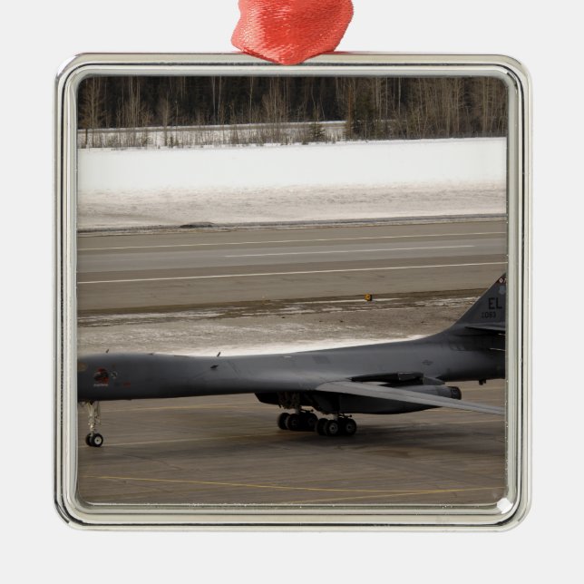 Ornement Carré Argenté Un Lancer B-1B effectue une touche et va (Devant)