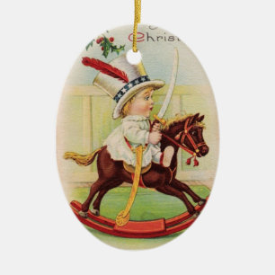 ORNEMENT EN CÉRAMIQUE LITTLE CHILD WITH TOP HAT ON THE TOY HORSE