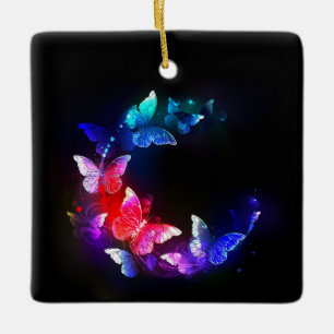 Ornement En Céramique Papillons de nuit néon lumineux sur fond noir