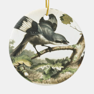 ORNEMENT ROND EN CÉRAMIQUE OISEAU DE PIE-GRIÈCHE AVEC L'INSECTE
