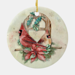 Ornement Rond En Céramique Paires de cardinaux d'hiver avec la poinsettia