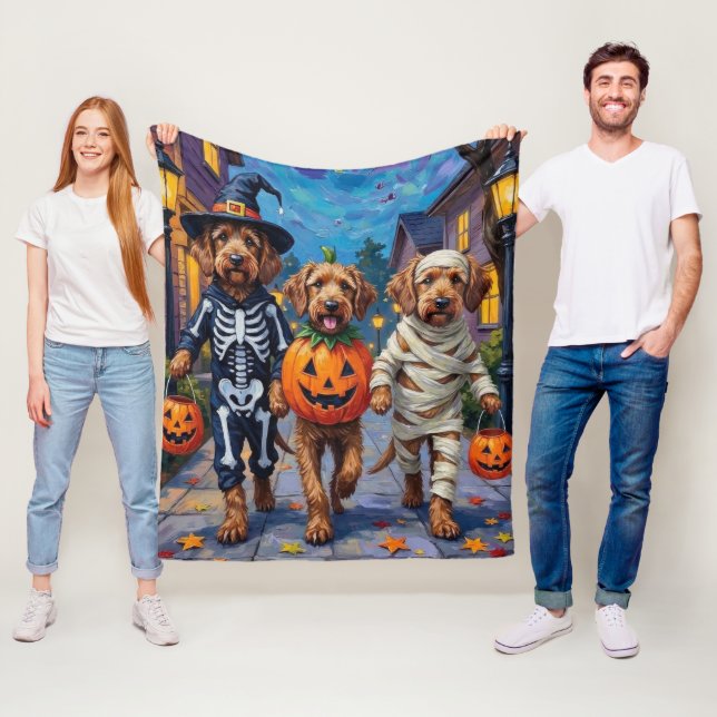 Otterhound Trick-or-Treating in Halloween Costumes Fleece Blanket (In Situ)