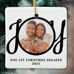 Our 1st Christmas Engaged Photo Keepsake Ceramic Ornament<br><div class="desc">This keepsake First Christmas Engaged photo ornament is decorated with the word JOY in black,  stylish script typography. Easily customizable.</div>