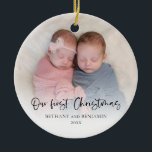 Our First Christmas 2 Photos Script Twin Baby Cera Ceramic Ornament<br><div class="desc">Our First Christmas 2 Photos Script Twin Baby Names and Year. Great keepsake gift. A playful set script for Our First Christmas and easy to personalise with your babys' names and the year and replace the sample photos on each side with your own favorites. On the front, a gradient overlay...</div>
