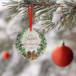 Our First Christmas as Grandparents Wreath Photo Ceramic Ornament<br><div class="desc">Celebrate your First Christmas as Grandparents with this beautiful festive holiday design ornament. It features a watercolor holiday wreath comprised of snow berries, pine cones and sprigs, red berries and faux bronze bells, on a natural looking faux birch bark background. "Christmas" and "Grandparents" are printed in festive red hand lettered...</div>