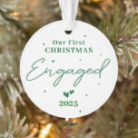 Our First Christmas Engaged 2025 – Personalized Ornament<br><div class="desc">Celebrate your engagement and the joy of the holiday season with this beautiful personalized ornament! Featuring the text “Our First Christmas Engaged 2025”, it’s the perfect keepsake to mark the beginning of your forever. Customize with your names, engagement date, or a special message to make it uniquely yours. A meaningful...</div>