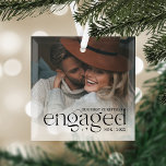 Our First Christmas Engaged Personalized Photo Glass Ornament<br><div class="desc">An elegant keepsake of your engagement year,  this beautiful glass ornament displays a favourite photo with "our first Christmas engaged" overlaid in black lettering accented with stars. Personalize with your initials and the year.</div>