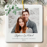 Our First Christmas Engaged Photo Ceramic Ornament<br><div class="desc">This First Christmas Engaged Photo Ornament is decorated with watercolor mistletoe and stylish script typography. Easily customizable with your photo, name, and year. Use the Design Tool to change the text size, style, or colour. Because we create our artwork you won't find this exact image from other designers. Original Watercolor...</div>