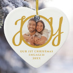 Our First Christmas Engaged Photo Heart-Shaped Ceramic Ornament<br><div class="desc">This keepsake heart-shaped First Christmas Engaged photo ceramic ornament is decorated with the word JOY in stylish gold script typography. Easily customizable.</div>