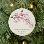 Our First Christmas Floral Elegant Newlywed Ceramic Ornament<br><div class="desc">Did you get married this year? Add a memory to your tree with this elegant floral keepsake ceramic ornament featuring a branch consisting of watercolor painted pink cherry blossom flowers on the top over an ivory background. Below is the message, "Our First Christmas as Mr. and Mrs." and the year...</div>