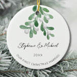 Our First Christmas Married  Ceramic Ornament<br><div class="desc">Celebrate your first Christmas as an engaged couple with this stylish ceramic ornament. 
It is decorated with watercolor mistletoe and elegant script typography.
Easily customizable.
Use the Design Tool to change the text size,  style,  or colour.
Original Watercolor © Michele Davies.</div>