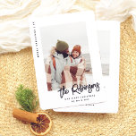 Our First Christmas Modern Married Newlywed Photo Holiday Card<br><div class="desc">Celebrate your first Christmas as newlyweds with this fun photo card! The design features “Merry Christmas” and the year running down the left side, leaving the spotlight for your favourite photo. You can use a wedding photo, a honeymoon snapshot, or a cute selfie! Your family name or names are written...</div>