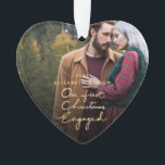 Our First Christmas Together Engaged Photo Heart Ornament<br><div class="desc">This holiday season, send out this beautiful photo Christmas heart-shaped ornament to a newly engaged couple to commemorate their engagement. The ornament features "Our First Christmas Engaged" in a beautifully hand-lettered faux gold foil font with space for one photo. Personalize the ornament by replacing the photo and text. For best...</div>