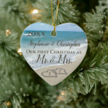 Our First Christmas Together Mr Mrs Beach Wedding Ceramic Ornament<br><div class="desc">Custom personalized names and year. Our Firt Christmas as Mr. and Mrs. Beach wedding ornament. Remember a beach wedding or honeymoon with this keepsake wedding ornament. First Christmas together with two interlocking beach wedding hearts drawn in the sand makes an elegant tropical ocean coastal nautical theme wedding, matching set of...</div>