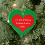 Our Second Christmas Together Cute Red Heart 2023  Ceramic Ornament<br><div class="desc">Personalized names and printed with cute red heart design in solid green background. Feel free to customize by adding your own texts,  names or photos. You can add your photo on the back side of the ornament easily!
The colour of the background can also be changed as you want.</div>