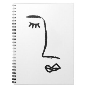 Outline of face painted with a watercolor brush. A Notebook