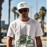 Over Par and Under the Influence Golf Hat<br><div class="desc">Celebrate golf’s real spirit with this vintage-inspired trucker hat! Featuring embroidered humour "OVER PAR AND UNDER THE INFLUENCE", it’s a nod to every golfer who prioritizes fun over birdies. Perfect for casual rounds, beer-cart moments, or roasting your foursome. Key Features: ⛳ Premium Comfort Structured foam front breathable mesh back Adjustable...</div>