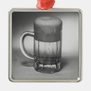 Overflowing beer glass metal ornament