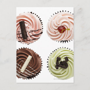 Overhead view of four cup cakes on white postcard