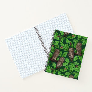 Owls in the forest on dark green notebook