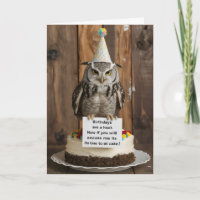 Own on birthday cake holding note with feet