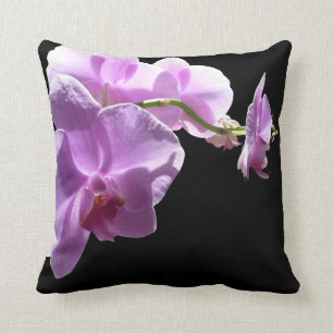 © P Wherrell Pink orchid on black background Throw Pillow
