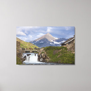 Packers lead string of horses over bridge above canvas print