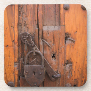 Padlock on wooden door coaster