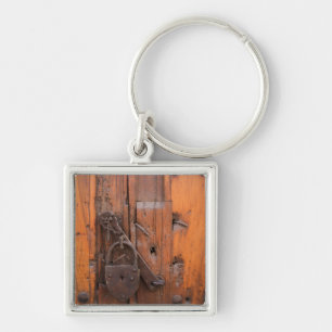 Padlock on wooden door keychain