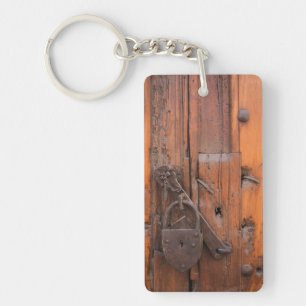 Padlock on wooden door keychain