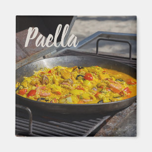 Paella is cooked on a grill gift for chef magnet