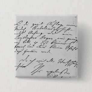 Page of text with his signature 2 inch square button