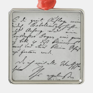 Page of text with his signature metal ornament