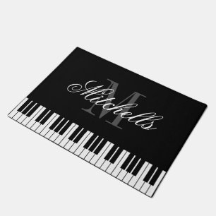Paillasson Le piano à queue noir et blanc verrouille le tapi