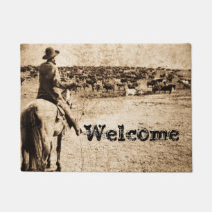 Paillasson Maison sur le cowboy de gamme et le troupeau de