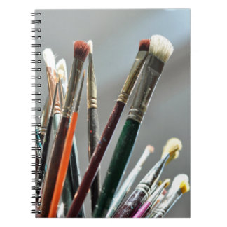 Paint brushes drying in the sunlight notebook