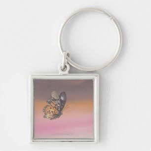 Painting depicting butterfly in flight keychain