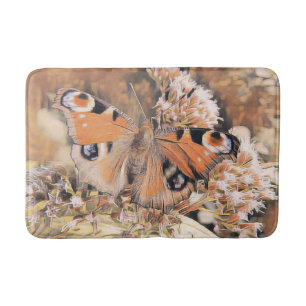 Painting of an orange butterfly on flowers bath ma bath mat