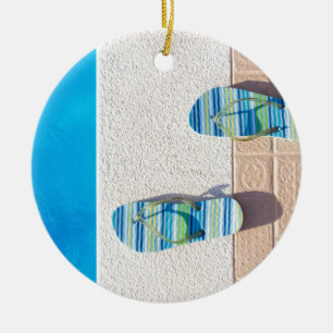 Pair of slippers at edge of swimming pool ceramic ornament