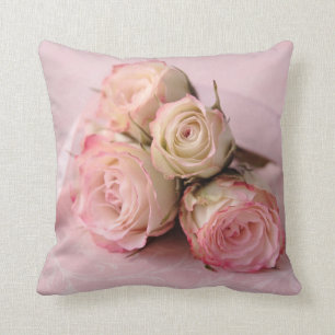 Pale roses on pink swirls throw pillow