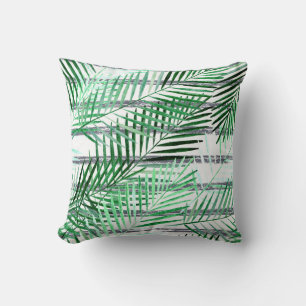 Palm leaves on a striped black and white backgroun throw pillow