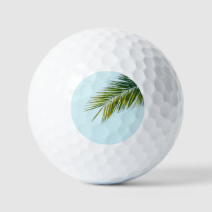 Palm tree branch golf balls