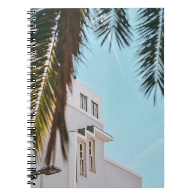 Palm tree near white concrete building notebook (Front)