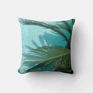palm tree over the water throw pillow