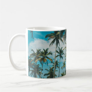 Palm trees above the ocean, vintage toned and retr coffee mug